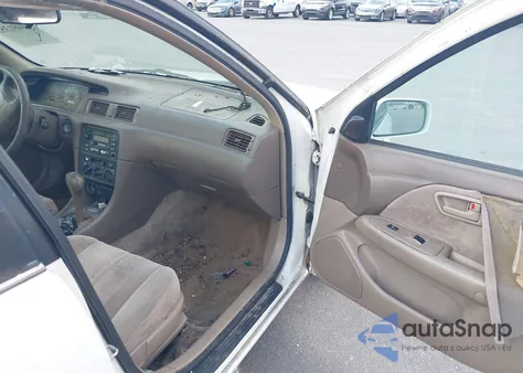 1999 Toyota Camry Le z USA, uszkodzony, nr VIN JT2BG22K1X0323278